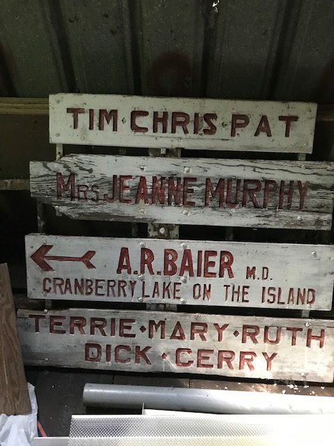photo of old signs with names of family members. Also says "Cranberry Lake on the Island"