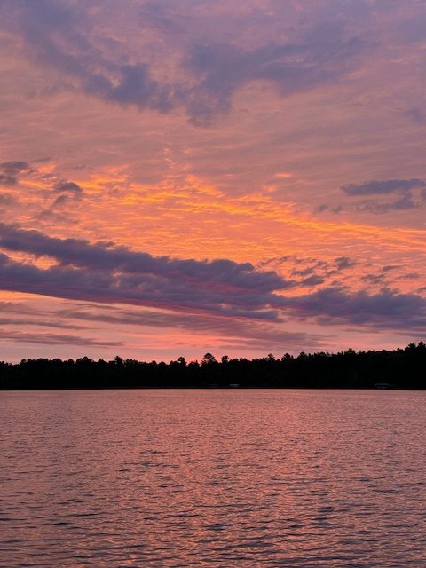 photo of sunrise above lake