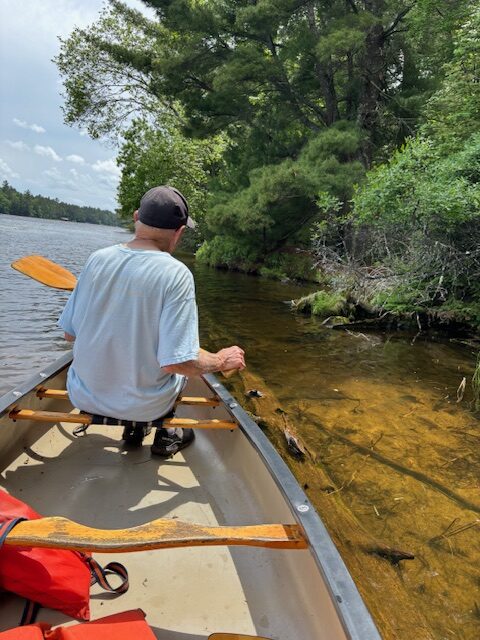 photo of man in canoe