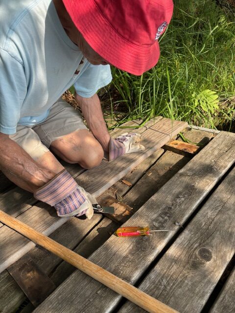 man working on pier boards
