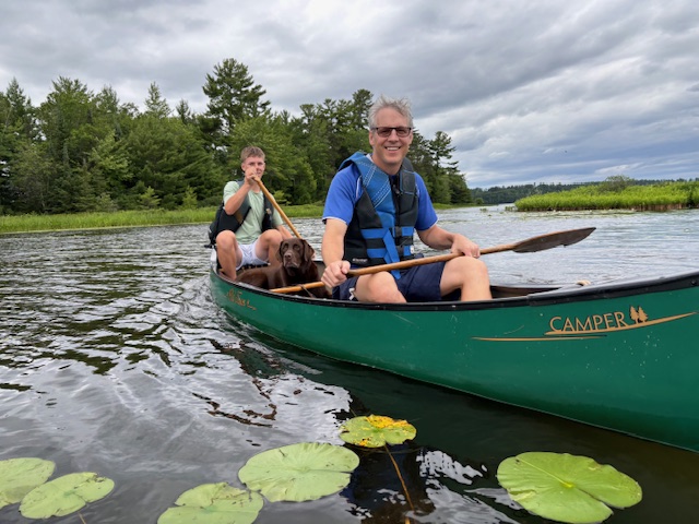 photo of two men in canoe