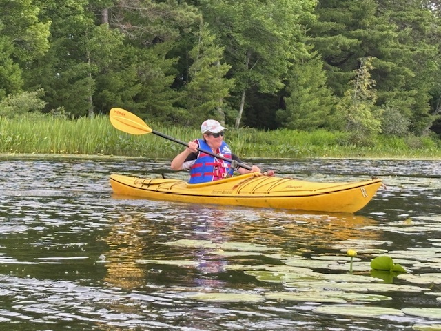 woman in kayak on lake