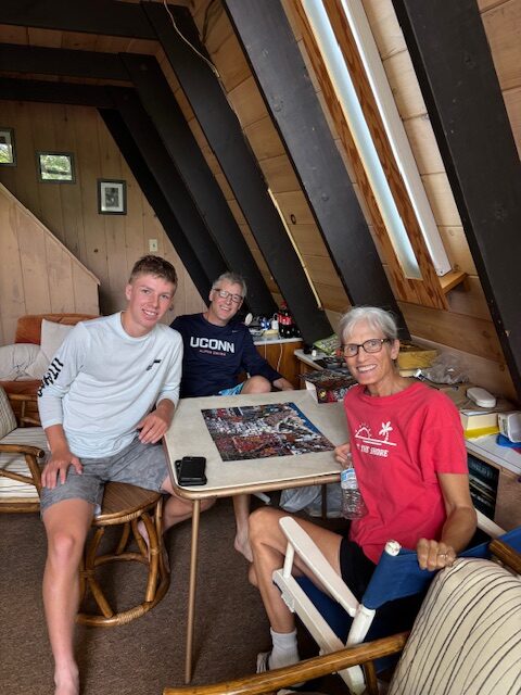 photo of the jigsaw puzzle crew with the completed puzzle