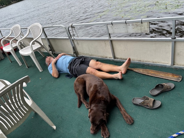 man and Rey resting on the barge