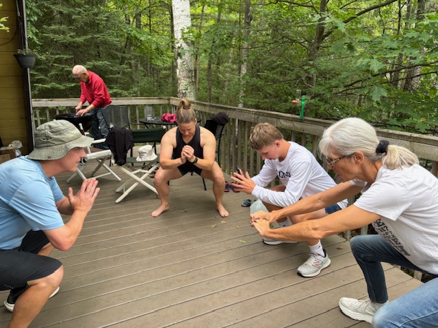 people doing squats on porch