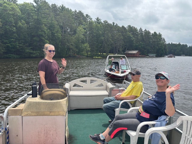 Barge rescue crew tows speed boat with a yellow rope