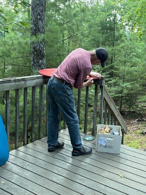 man sealing circle board