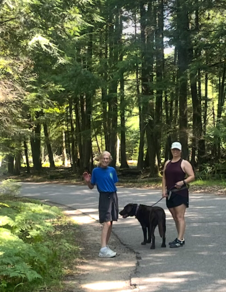 mom and daughter walking dog