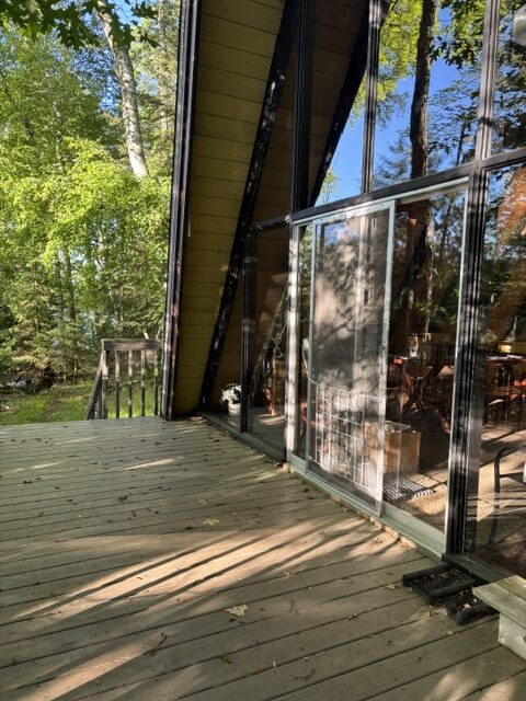 photo or a-frame porch and entrance