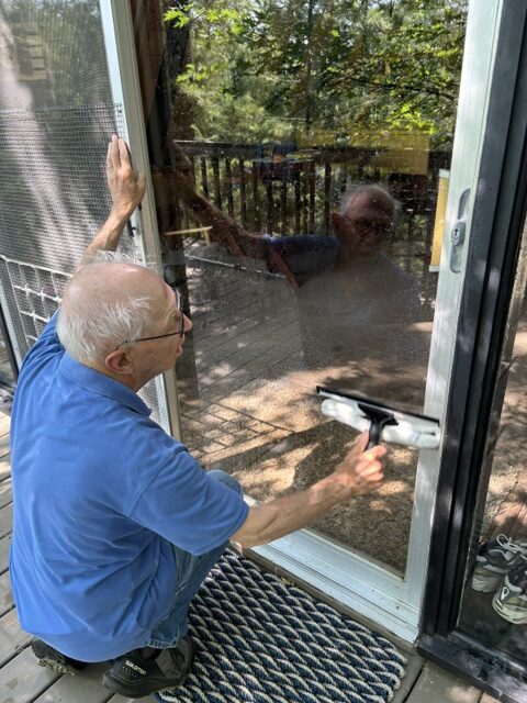 man cleaning window