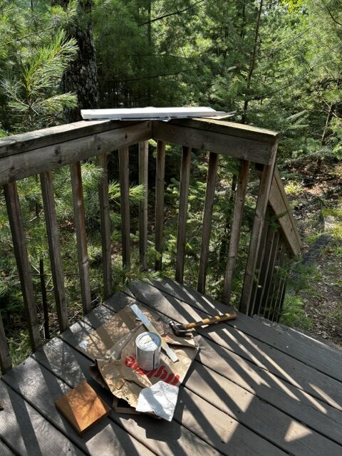 home made sign "workshop" area on deck